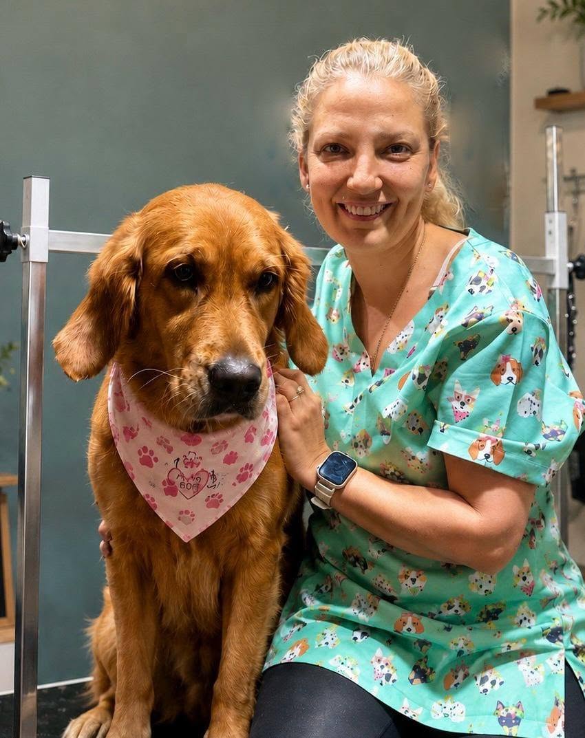 Groomer with golden retriever at Wagging Tails Pet Parlour